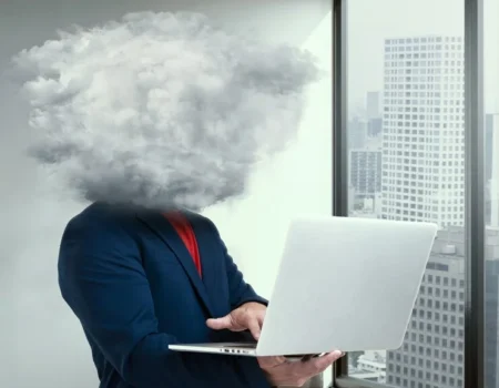 Business person with a cloud for a head holding a laptop, representing the surreal and dark humor of the Cursed-Memes.com Business.