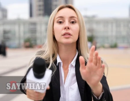 Erica Kruzinski 7 News reporter addressed the camera outdoors with a microphone.