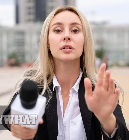 Erica Kruzinski 7 News reporter addressed the camera outdoors with a microphone.