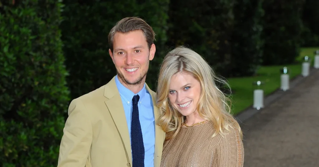 Alex Cowper Smith smiling outdoors in a tan blazer and blue shirt, capturing Alex Cowper Smith’s approachable and professional style.