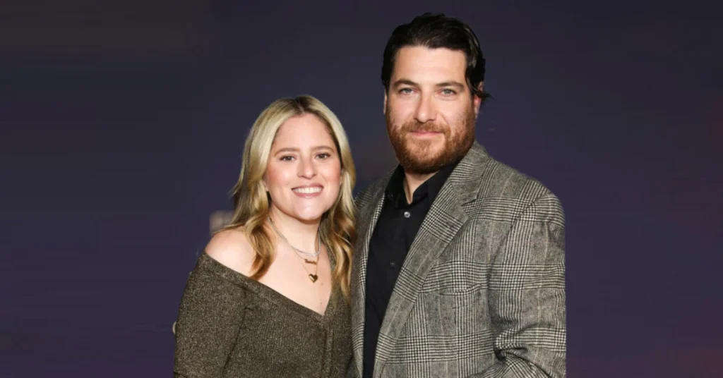 Daniella Liben, fashion entrepreneur and Adam Pally’s wife, smiling in a stylish outfit.