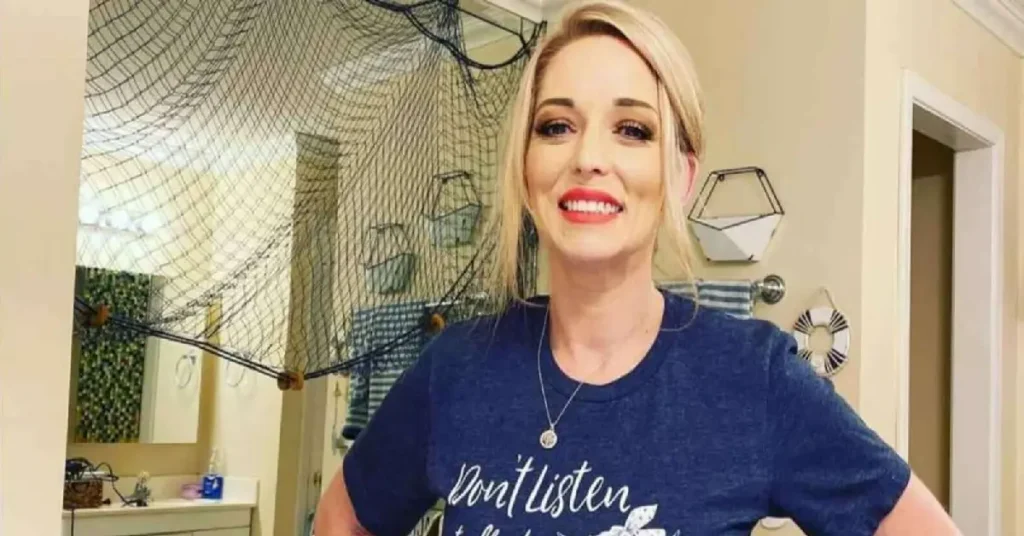 Ophelia Nichols net worth - TikTok star Mama Tot smiling in blue shirt at home