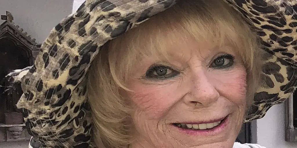 Elke Sommer net worth story: Elke Sommer smiling in a leopard print hat