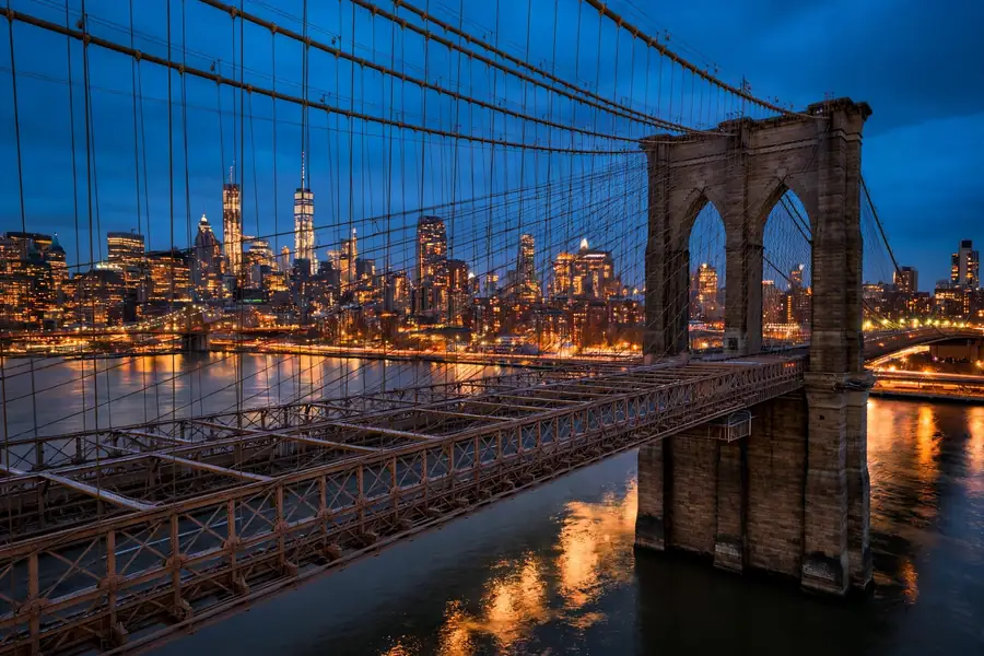 Jay-Z net worth journey: the New York skyline and Brooklyn Bridge at dusk