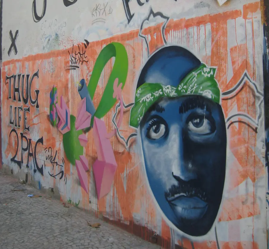 Tupac net worth story: Rio mural showing Tupac with Thug Life lettering